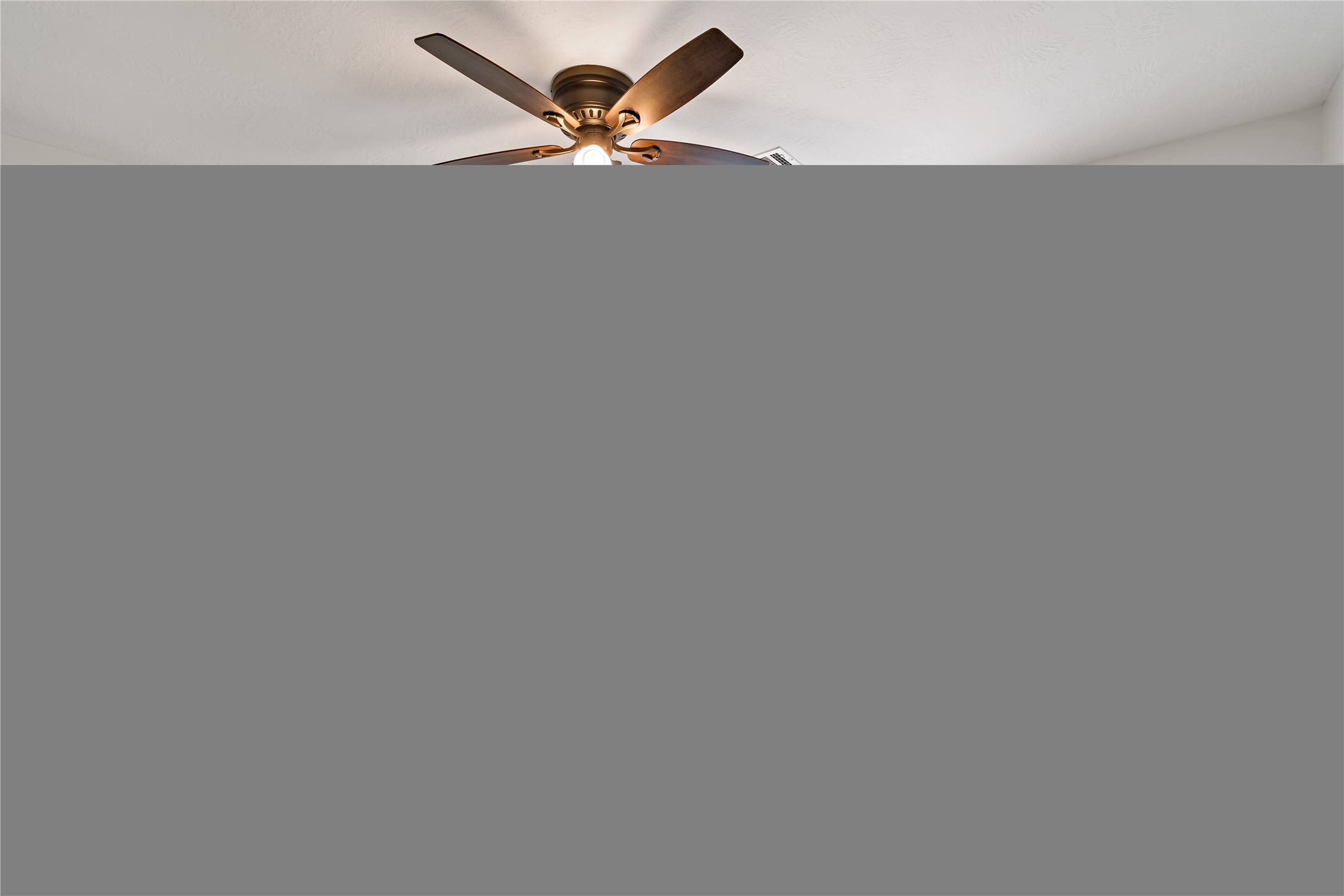 507 Firnat Street Houston, TX 77022 - Photo 15 of 22 a view of a big room with a fan