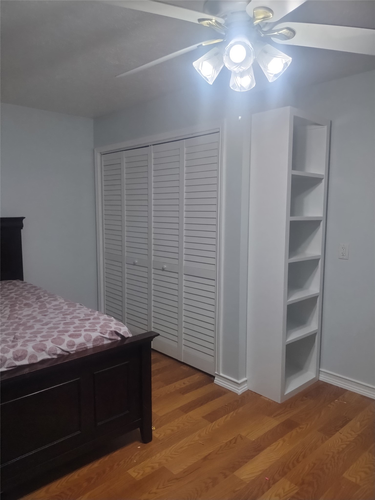 507 Firnat Street Houston, TX 77022 - Photo 22 of 22 a bedroom with a bed and a chandelier