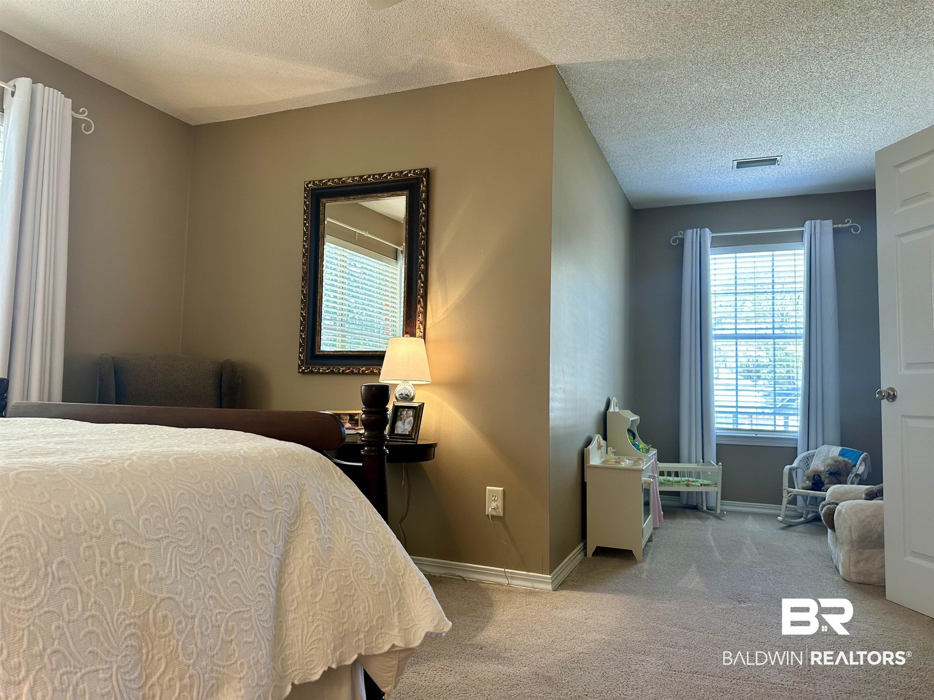 148 Brooks Boulevard Brewton, AL 36426 - Photo 30 of 45 Bedroom with visible vents, baseboards, carpet, and a textured ceiling