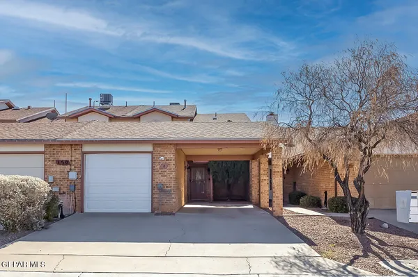 a front view of a house with a garage