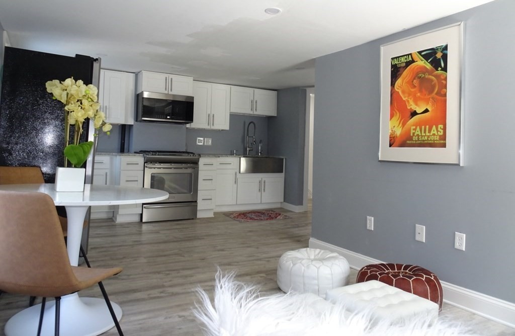 a bedroom with a bed and a television