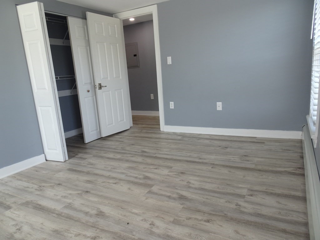 416 Crescent Avenue Chelsea, MA 02150 - Photo 14 of 21 an empty room with wooden floor and closet