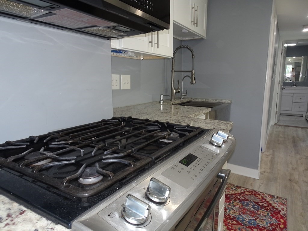 416 Crescent Avenue Chelsea, MA 02150 - Photo 7 of 21 a stove top oven sitting inside of a kitchen