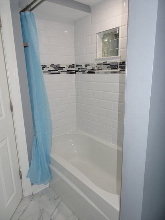 416 Crescent Avenue Chelsea, MA 02150 - Photo 10 of 21 a bathroom with a bathtub