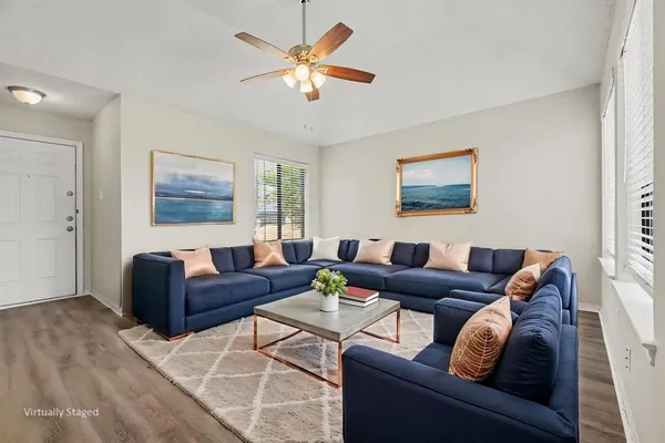 a living room with furniture and a window