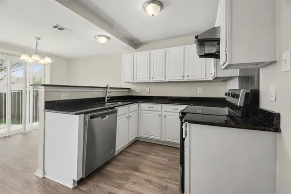 a kitchen with a sink and cabinets