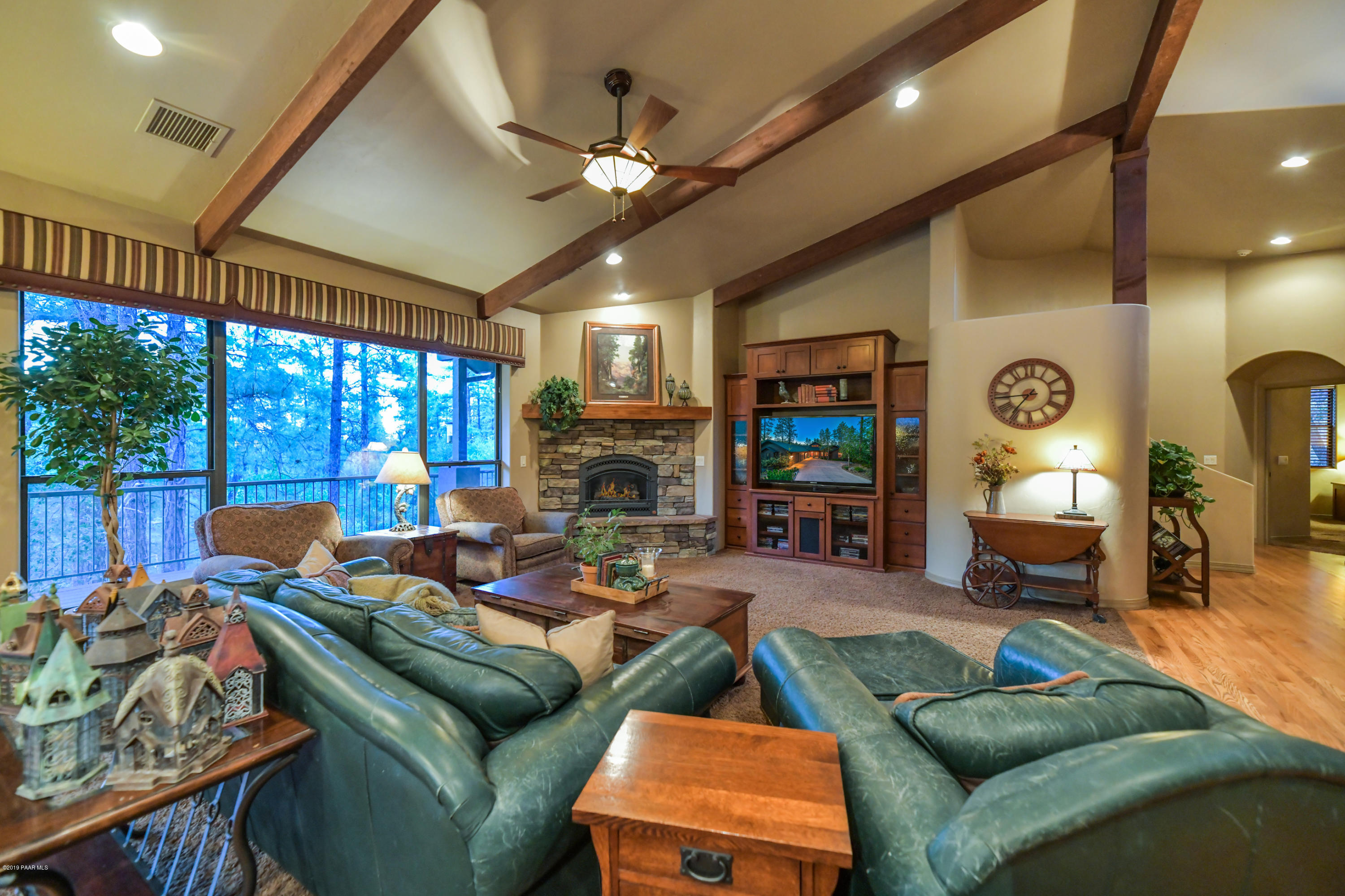 1408 East Valley View Road Prescott, AZ 86303 - Photo 53 of 76 a living room with furniture a large window and a fireplace
