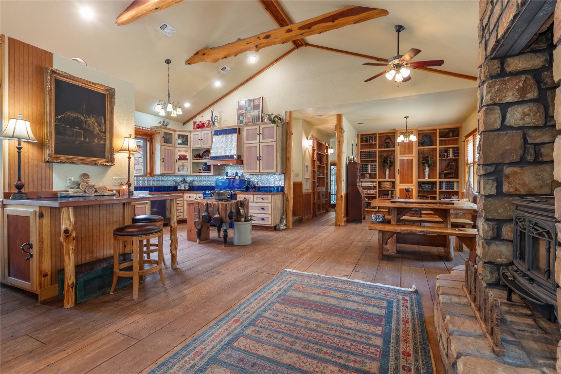 a living room with lots of furniture and kitchen view