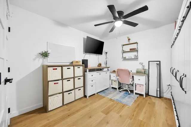 a bedroom with a bed and a dresser