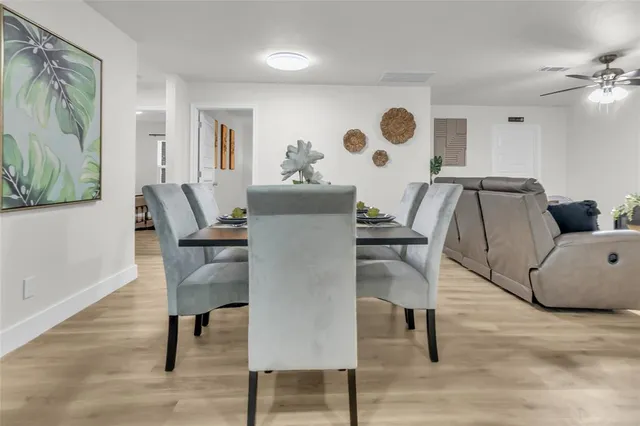 a view of a livingroom with furniture and wooden floor