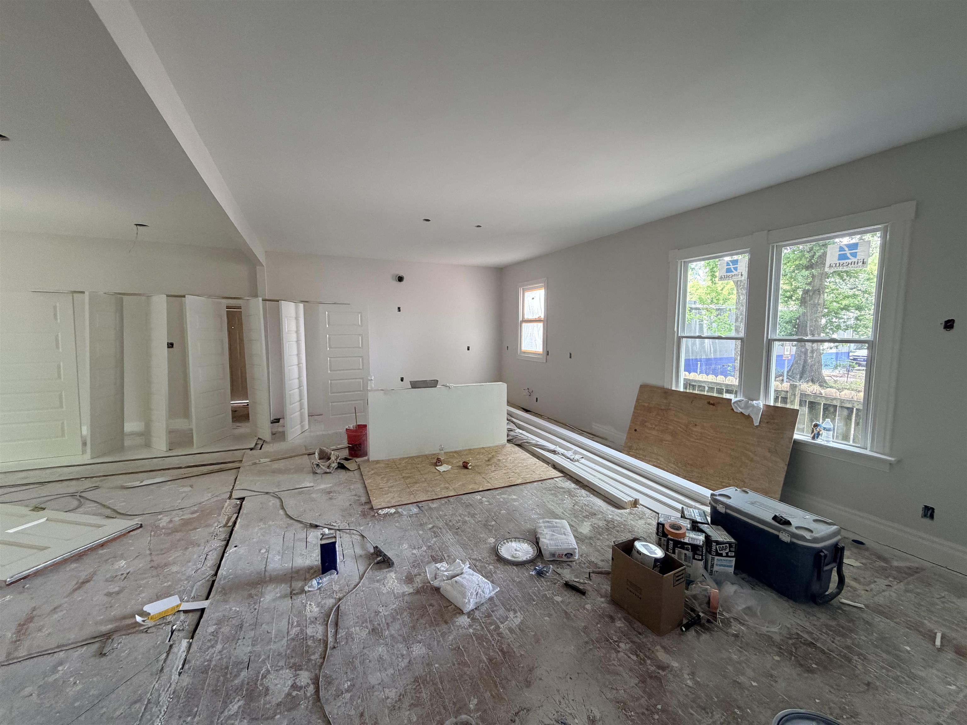 961 Meda Street Memphis, TN 38104 - Photo 8 of 27 Spacious interior featuring multiple windows, smooth white walls, and a flat ceiling
