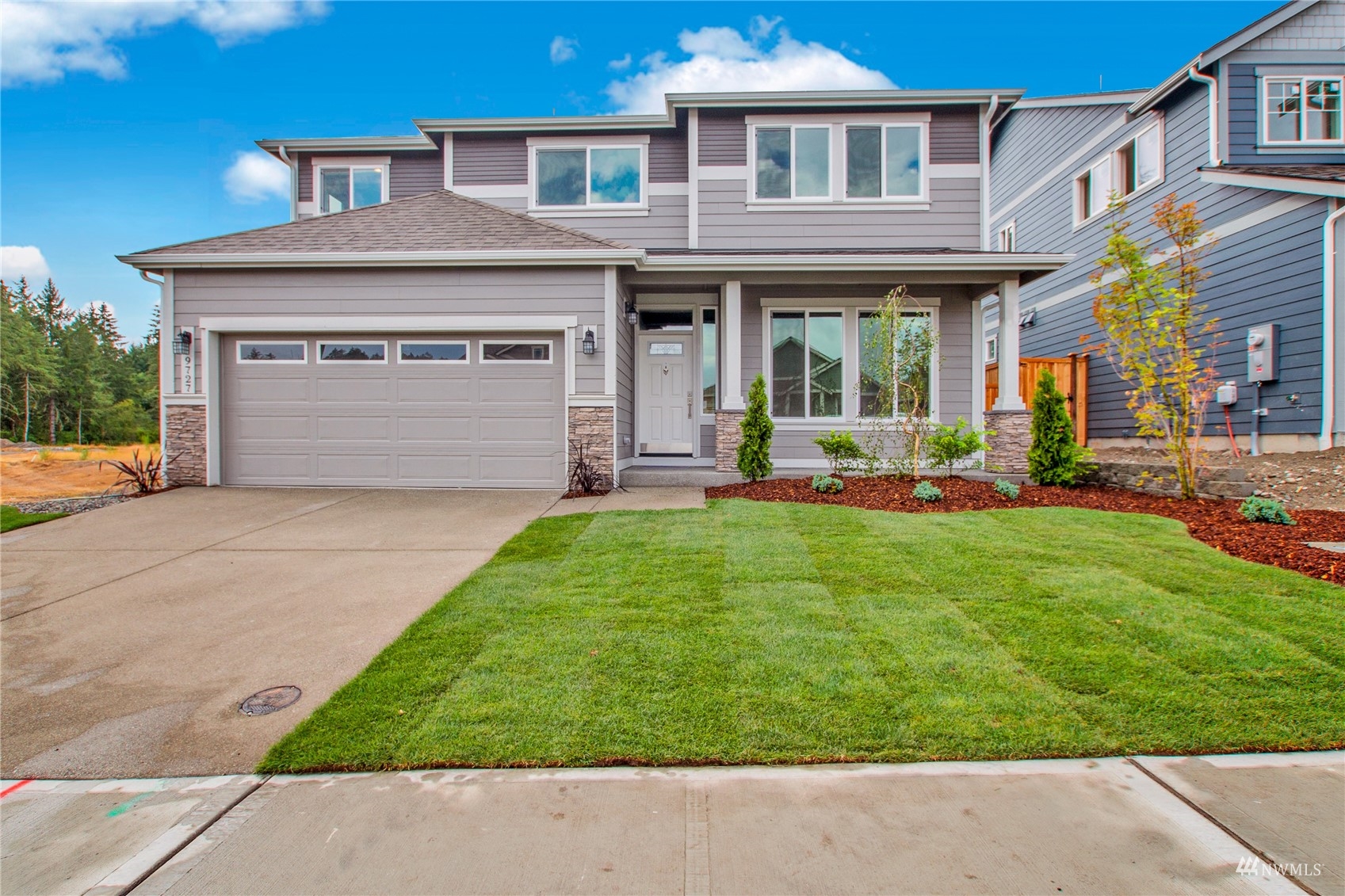 9727 9th Avenue Southeast Lacey, WA 98513 - Photo 1 of 38 a front view of a house with a yard and porch