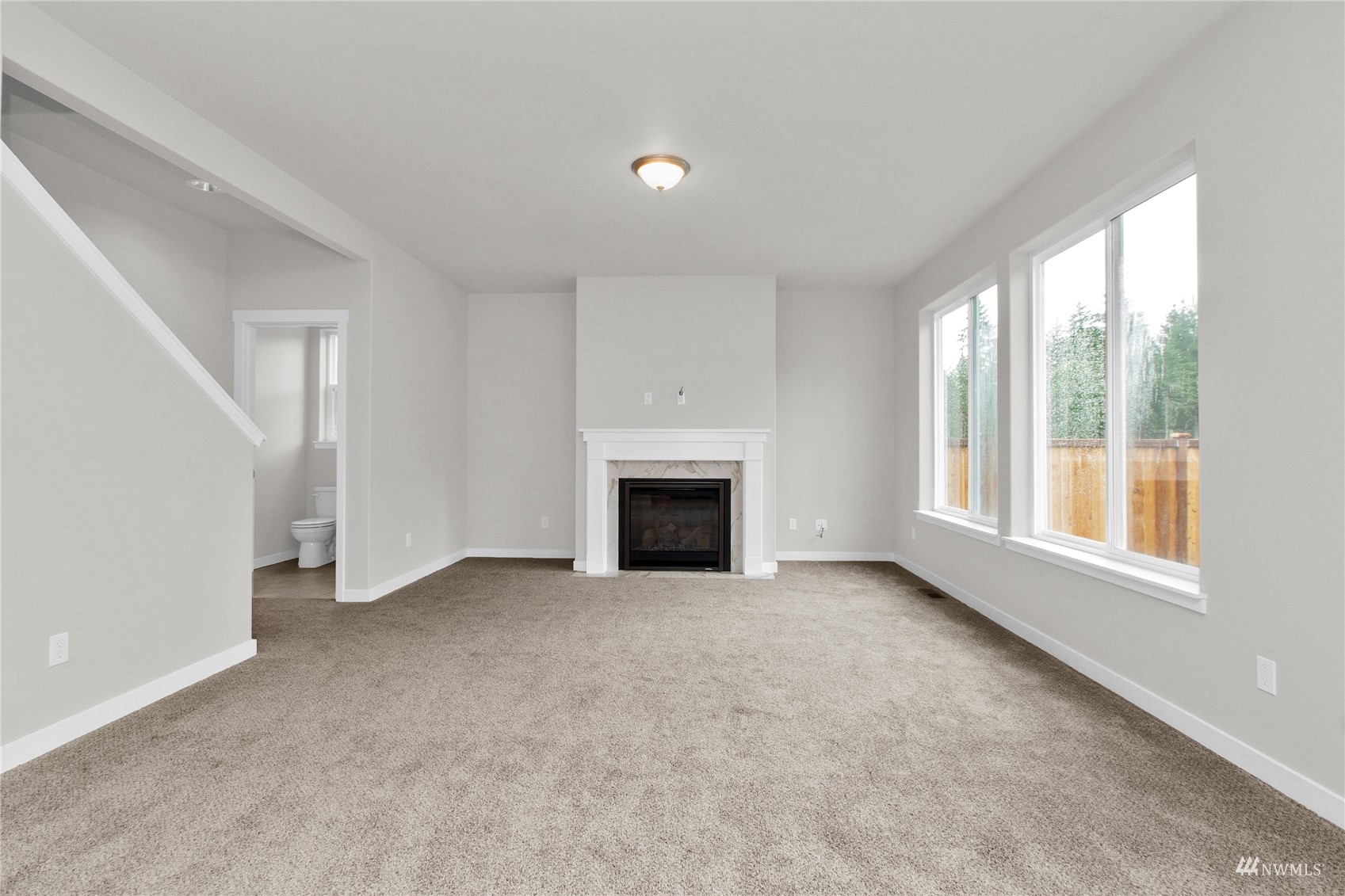 9727 9th Avenue Southeast Lacey, WA 98513 - Photo 12 of 38 a view of an empty room with a window