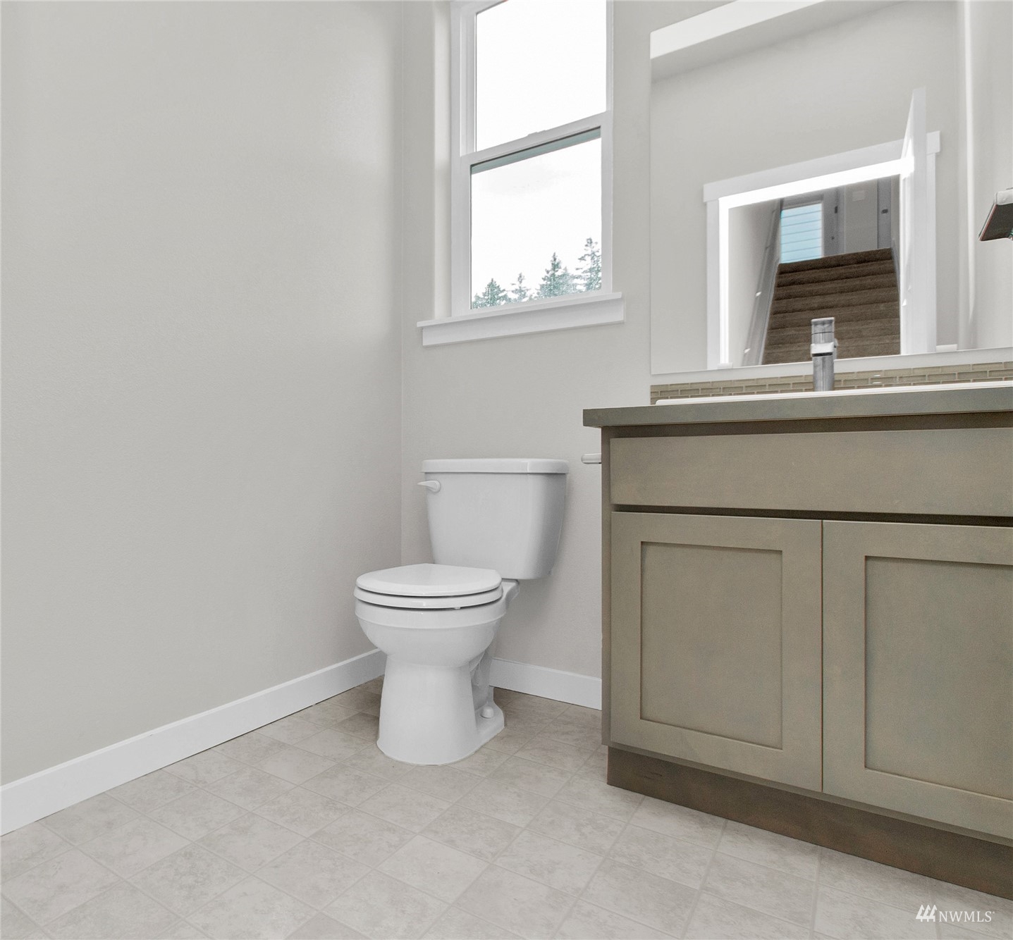 9727 9th Avenue Southeast Lacey, WA 98513 - Photo 16 of 38 a bathroom with a toilet sink and window