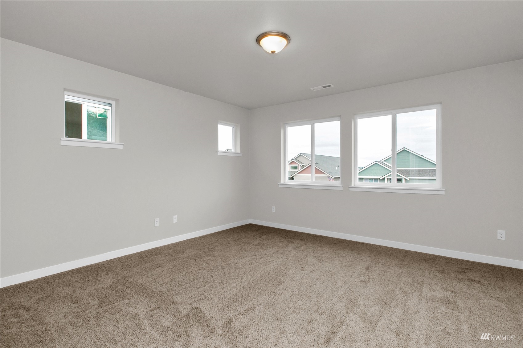 9727 9th Avenue Southeast Lacey, WA 98513 - Photo 17 of 38 an empty room with windows