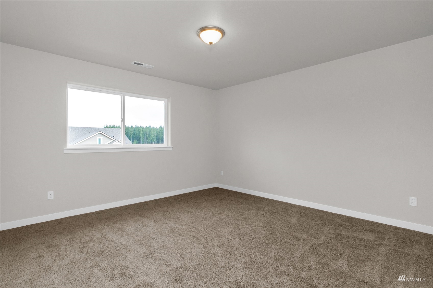 9727 9th Avenue Southeast Lacey, WA 98513 - Photo 21 of 38 an empty room with windows