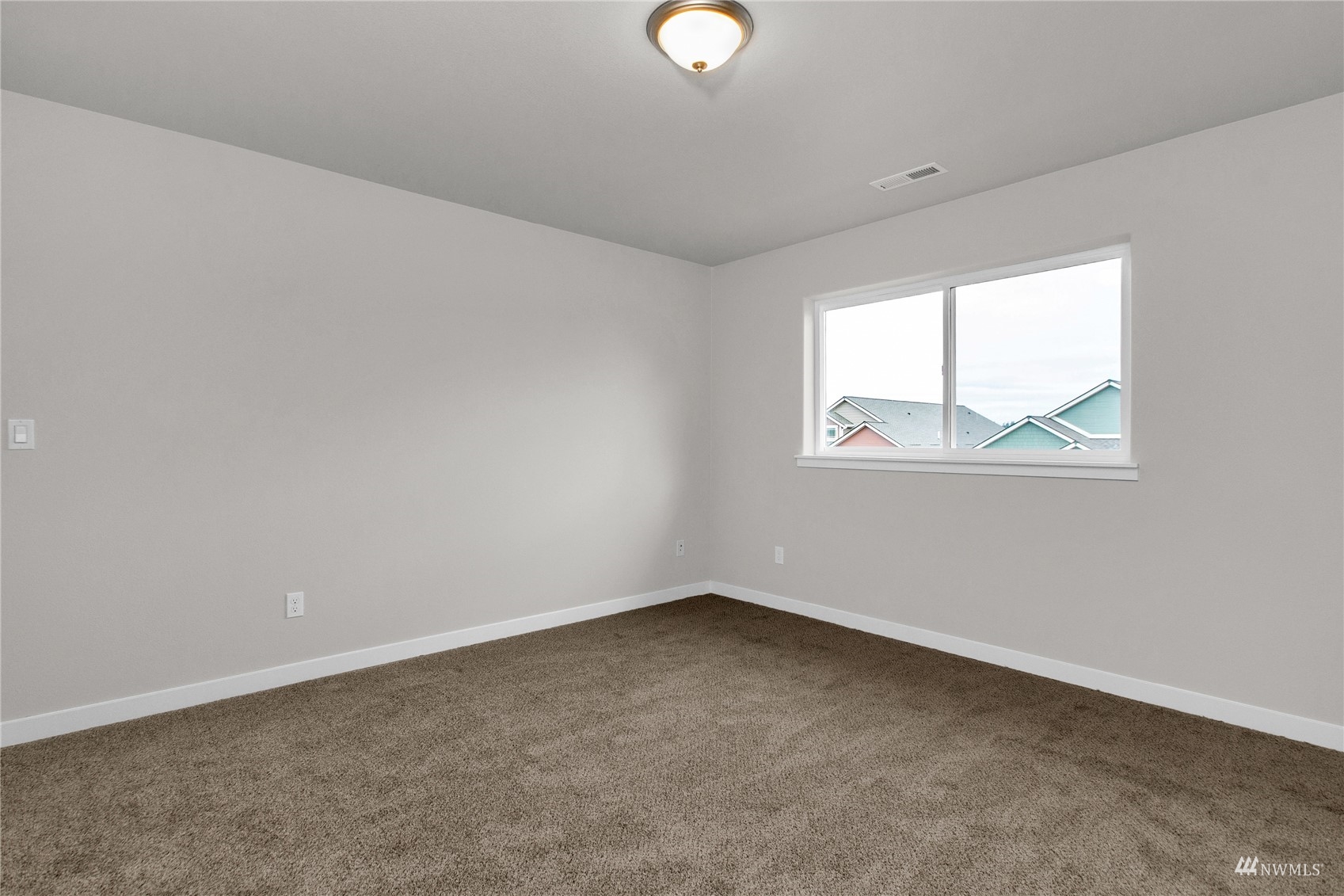 9727 9th Avenue Southeast Lacey, WA 98513 - Photo 23 of 38 an empty room with a window