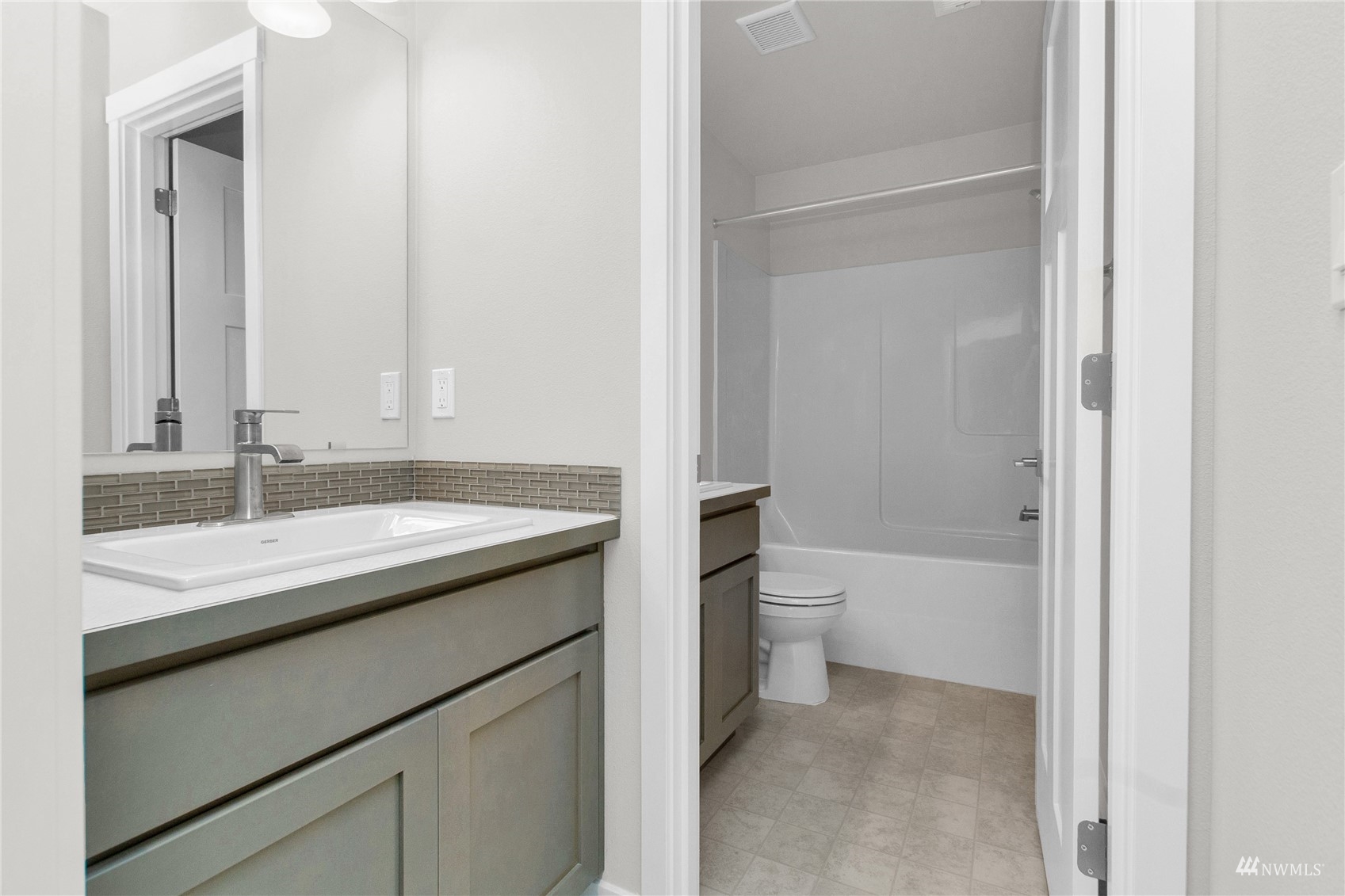 9727 9th Avenue Southeast Lacey, WA 98513 - Photo 28 of 38 a bathroom with a granite countertop sink toilet and shower
