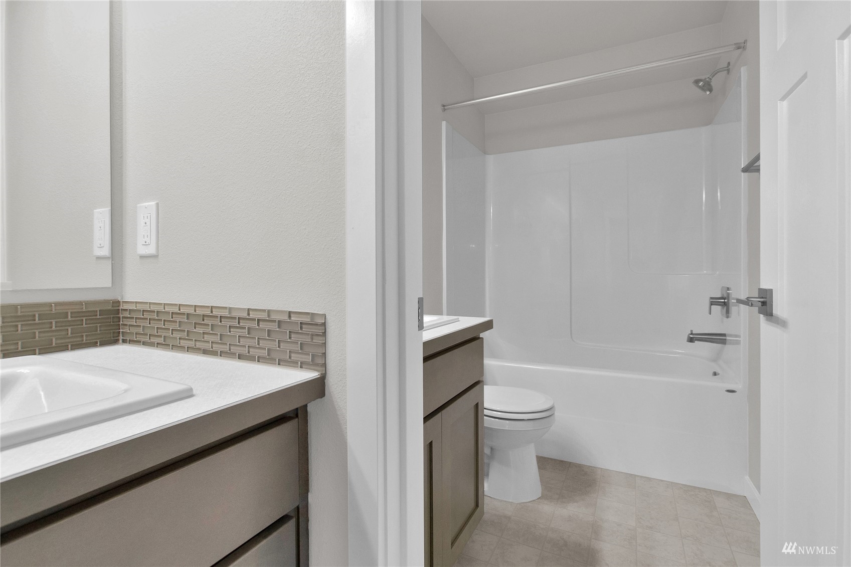 9727 9th Avenue Southeast Lacey, WA 98513 - Photo 29 of 38 a bathroom with a sink a toilet and shower