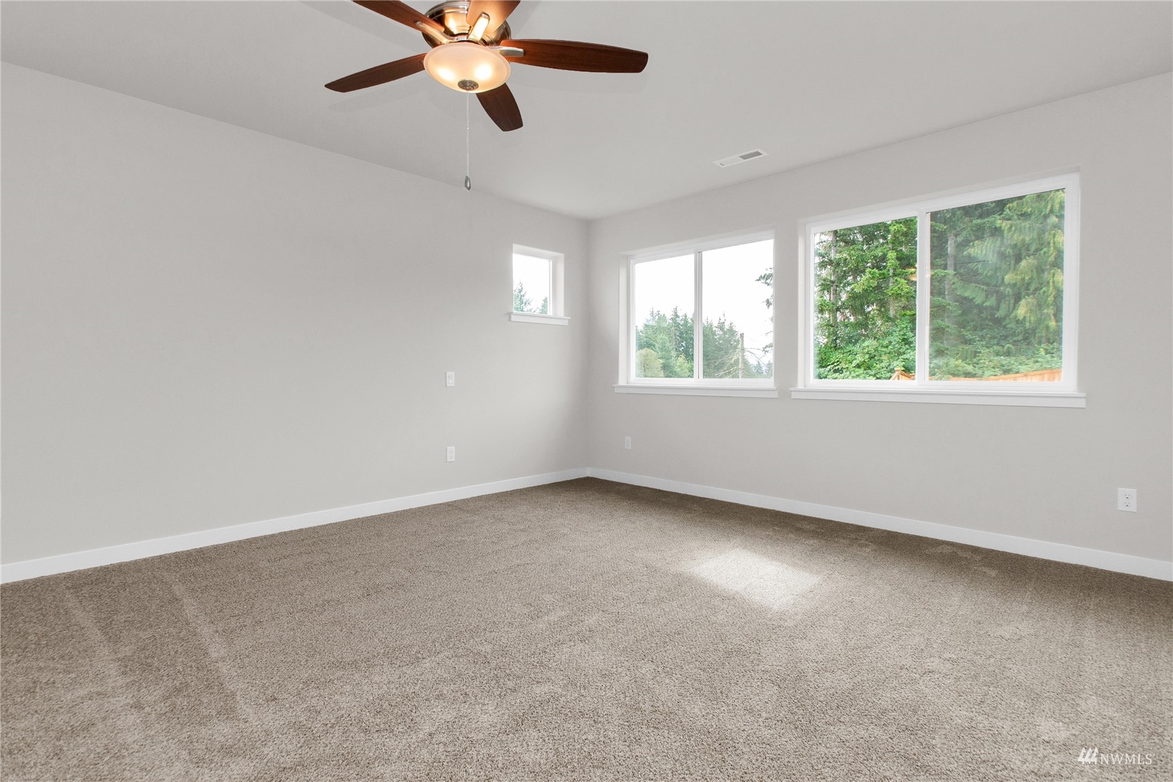 9727 9th Avenue Southeast Lacey, WA 98513 - Photo 30 of 38 an empty room with a window and a fan