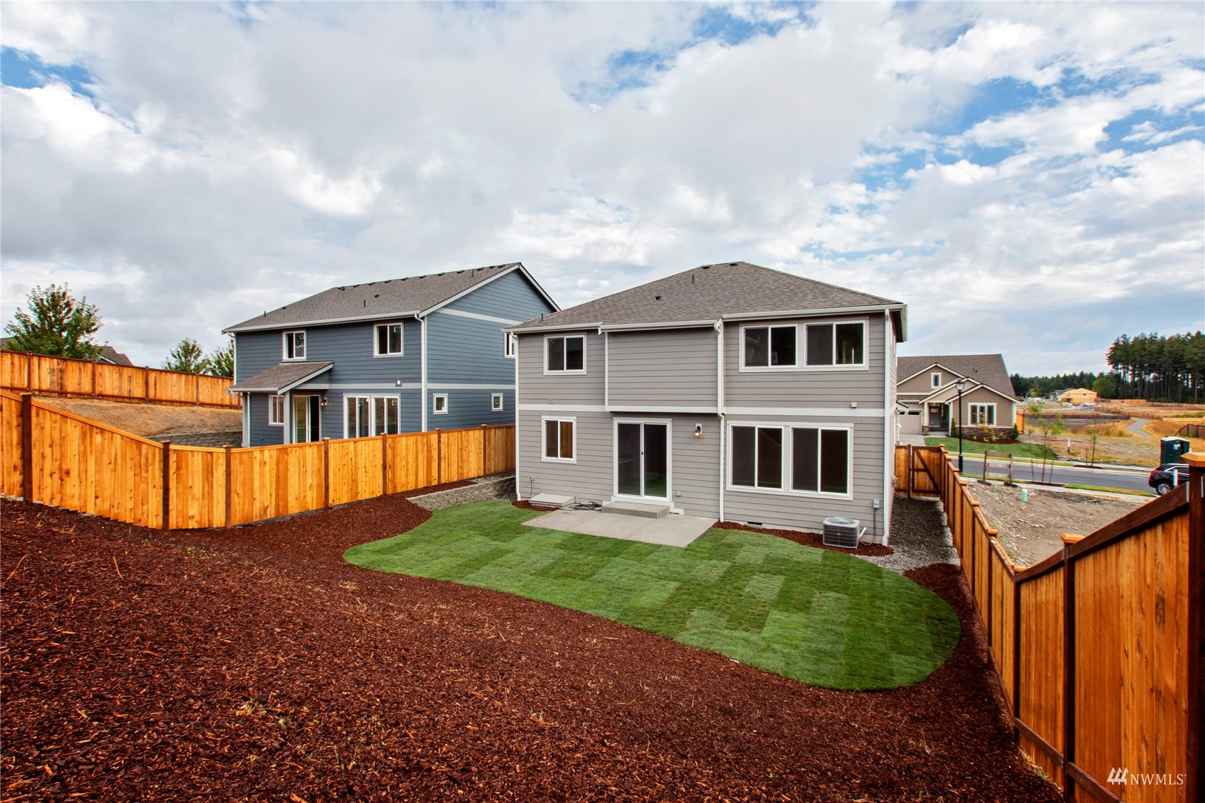 9727 9th Avenue Southeast Lacey, WA 98513 - Photo 37 of 38 a view of a house with a big yard and large trees