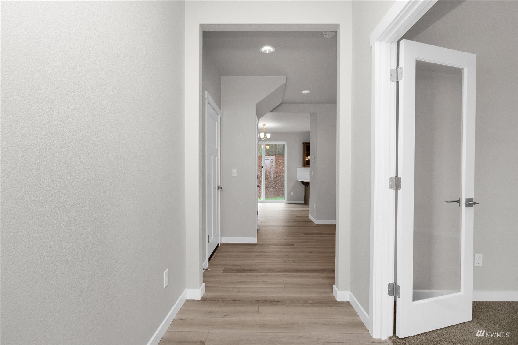 9727 9th Avenue Southeast Lacey, WA 98513 - Photo 4 of 38 a view of a hallway with wooden floor and entryway