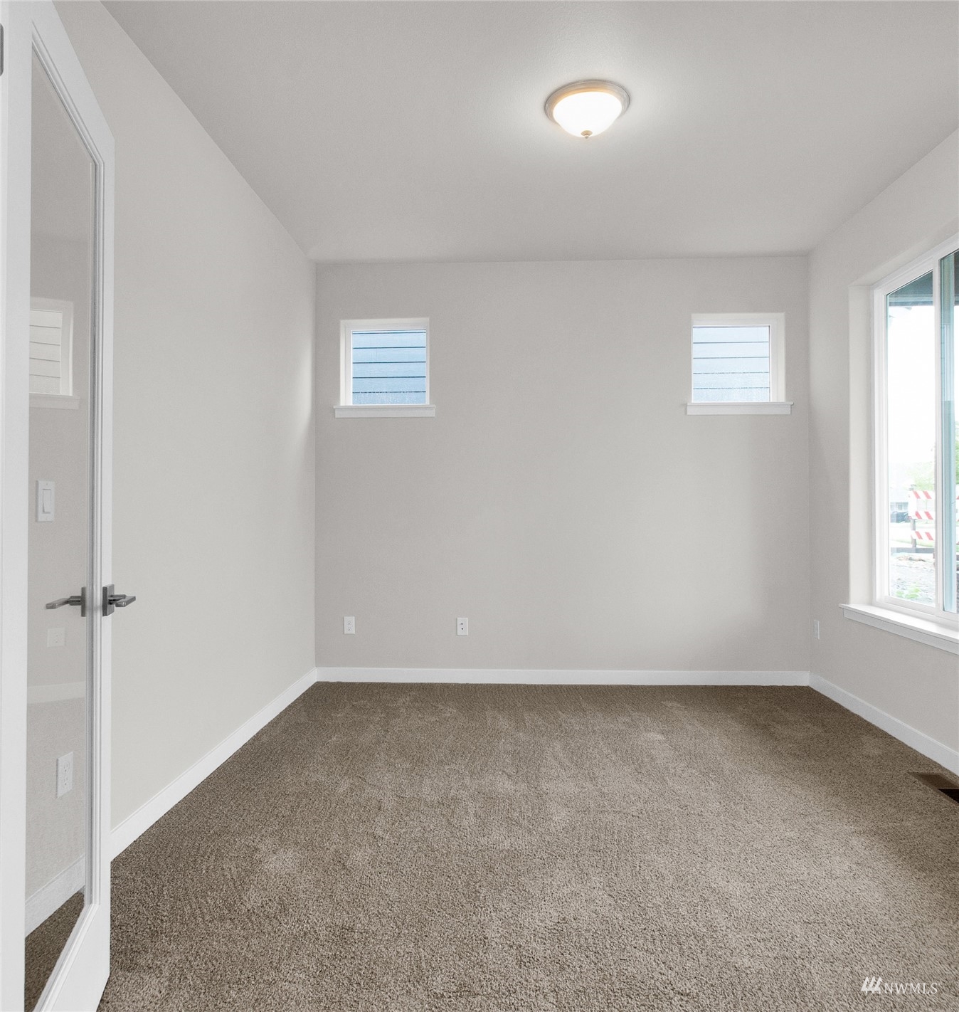 9727 9th Avenue Southeast Lacey, WA 98513 - Photo 5 of 38 an empty room with a window