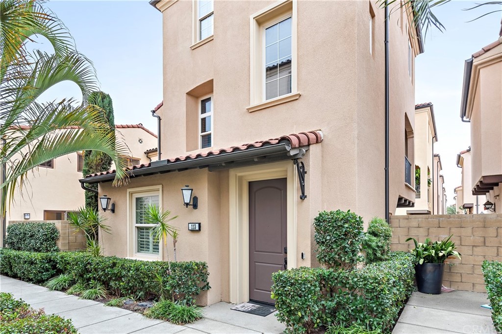 113 Painted Trellis Irvine, CA 92620 - Photo 1 of 26 a front view of a house with a garden