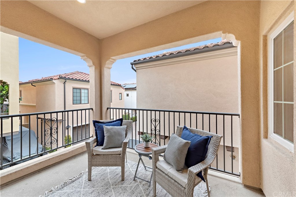 113 Painted Trellis Irvine, CA 92620 - Photo 12 of 26 a view of a chair and table in the balcony