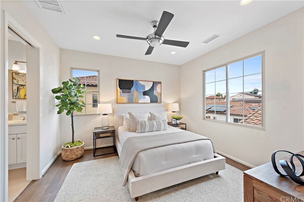 113 Painted Trellis Irvine, CA 92620 - Photo 13 of 26 a bedroom with a balcony a bed and a chandelier