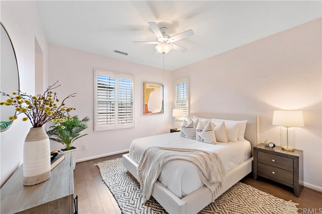 113 Painted Trellis Irvine, CA 92620 - Photo 18 of 26 a bedroom with a bed and a potted plant