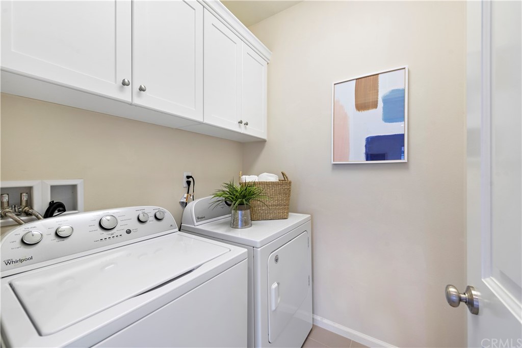 113 Painted Trellis Irvine, CA 92620 - Photo 20 of 26 a utility room with dryer and washer