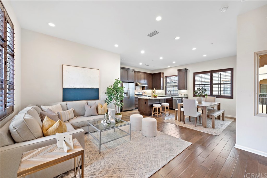 113 Painted Trellis Irvine, CA 92620 - Photo 5 of 26 a living room with furniture and a wooden floor