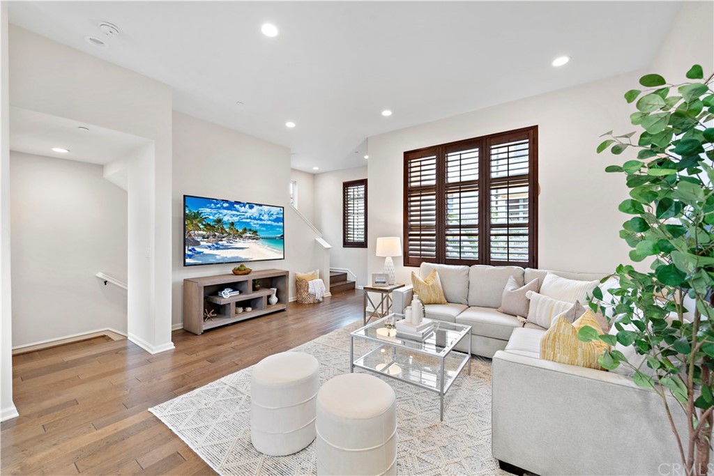 113 Painted Trellis Irvine, CA 92620 - Photo 10 of 26 a living room with furniture and a flat screen tv