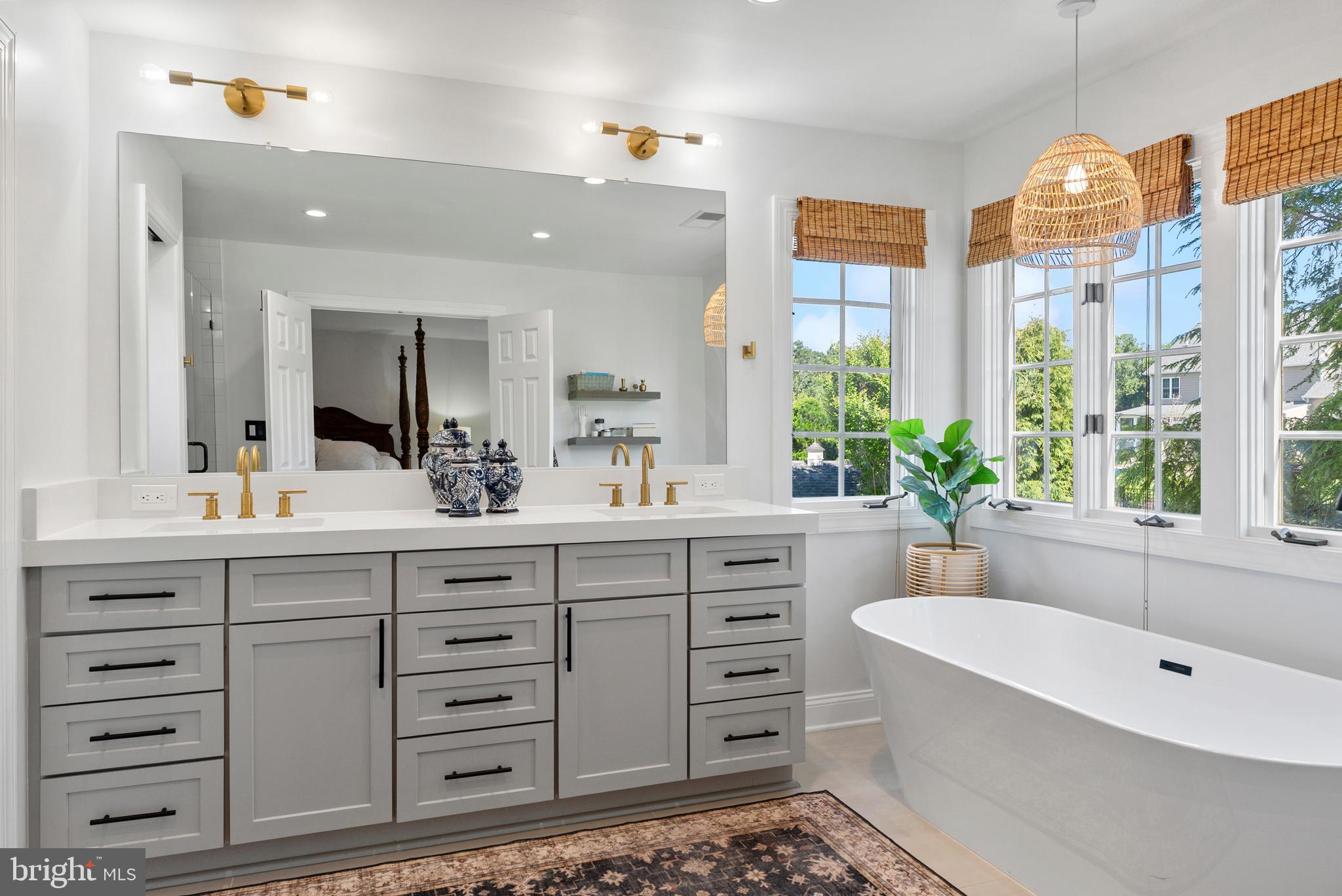 7 Redtree Lane Reisterstown, MD 21136 - Photo 35 of 56 a spacious bathroom with double vanity sink a two mirror a window and a bathtub