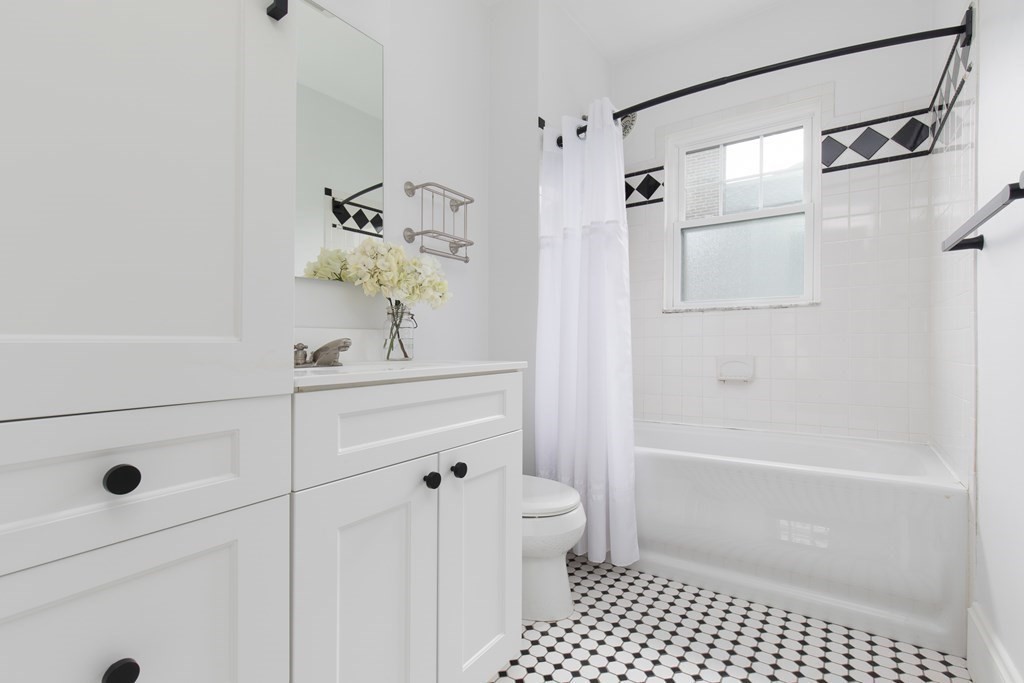 6-8 Longfellow Road Cambridge, MA 02138 - Photo 13 of 40 a bathroom with a sink a toilet a shower and vanity