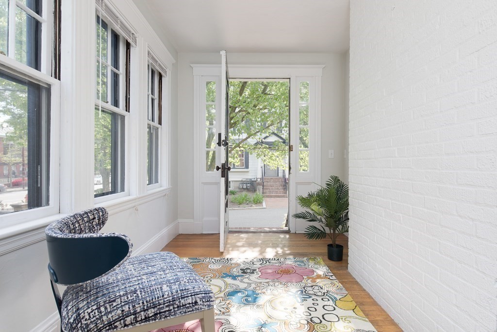 6-8 Longfellow Road Cambridge, MA 02138 - Photo 21 of 40 a living room with furniture and a potted plant