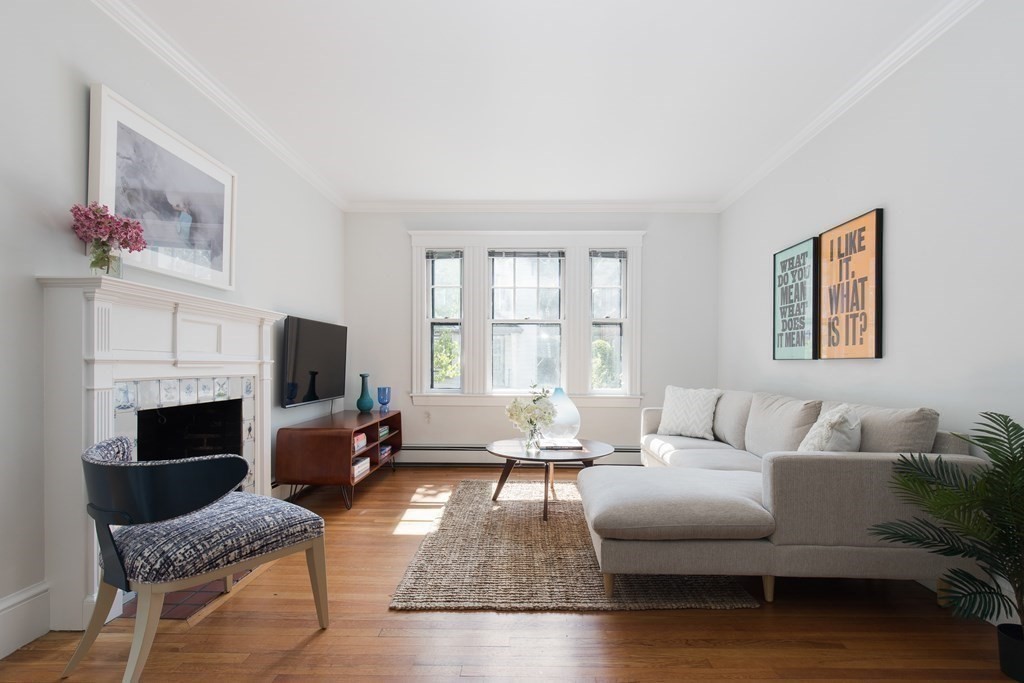 6-8 Longfellow Road Cambridge, MA 02138 - Photo 23 of 40 a living room with furniture fireplace and a window