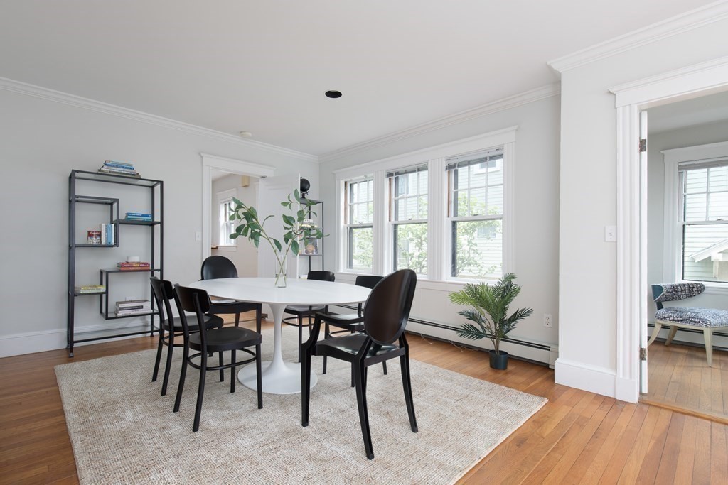6-8 Longfellow Road Cambridge, MA 02138 - Photo 24 of 40 a view of a dining room with furniture window and wooden floor