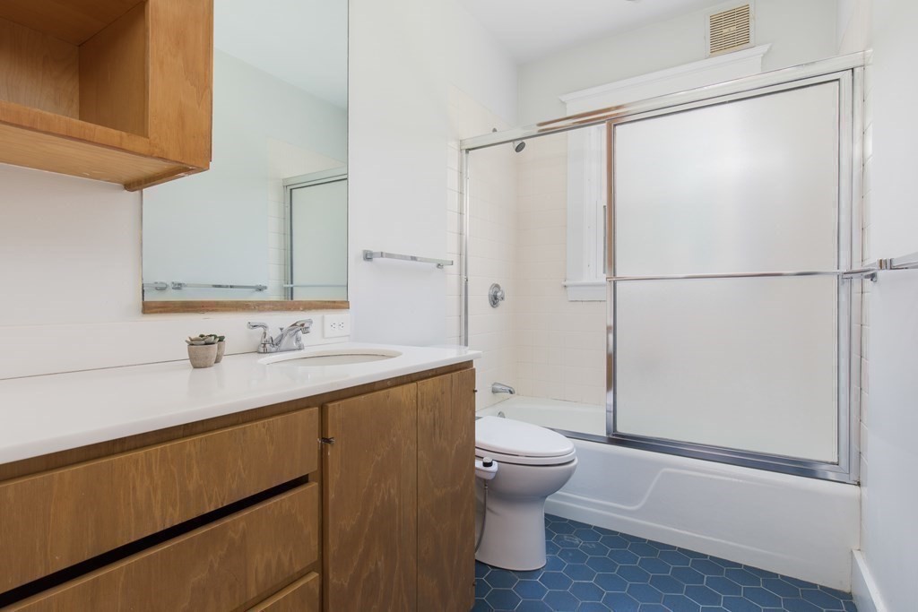 6-8 Longfellow Road Cambridge, MA 02138 - Photo 30 of 40 a bathroom with a sink a toilet and shower