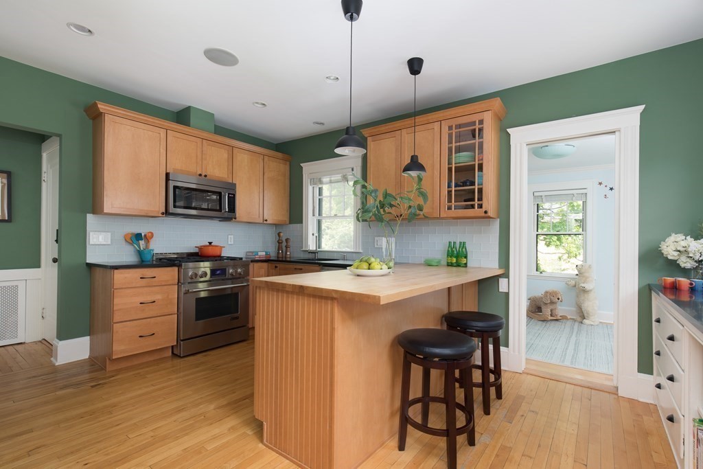 6-8 Longfellow Road Cambridge, MA 02138 - Photo 3 of 40 a kitchen with stainless steel appliances granite countertop a stove and a refrigerator