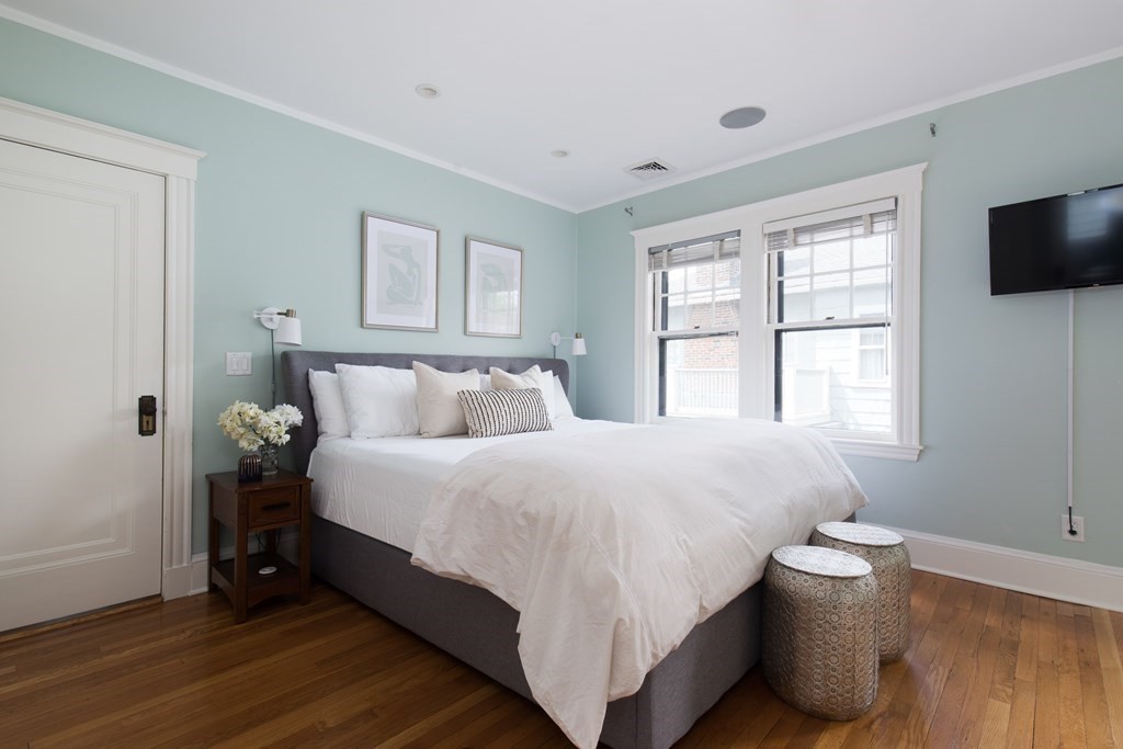 6-8 Longfellow Road Cambridge, MA 02138 - Photo 10 of 40 a bedroom with a bed and a flat screen tv