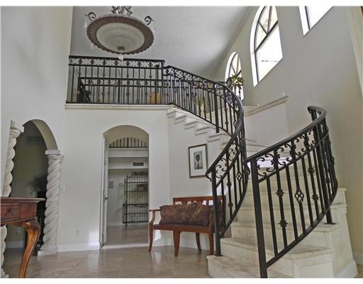 3 Middle Road Stuart, FL 34996 - Photo 4 of 25 a view of entryway and hall with wooden floor