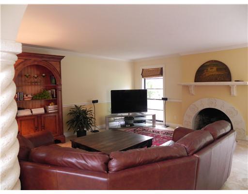 3 Middle Road Stuart, FL 34996 - Photo 6 of 25 a living room with furniture a fireplace and flat screen tv