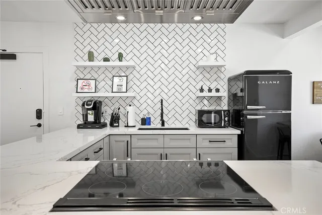 a bedroom with a bed and lamp