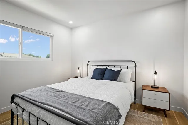 a bedroom with a large bed and a window