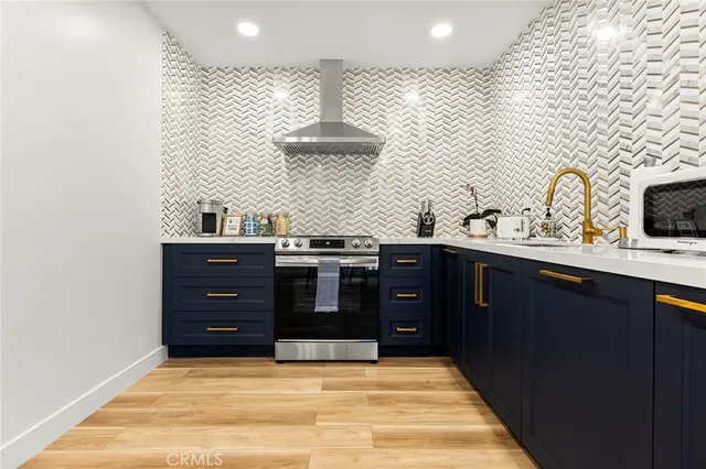 a kitchen with a stove and a microwave