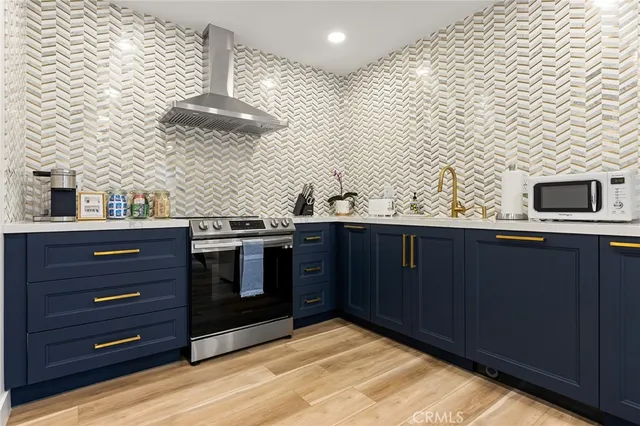 a view of a dining room with a table and chairs