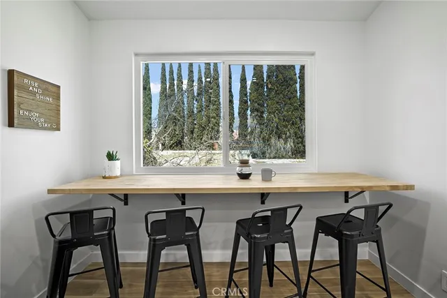 a kitchen with a table and chairs in it