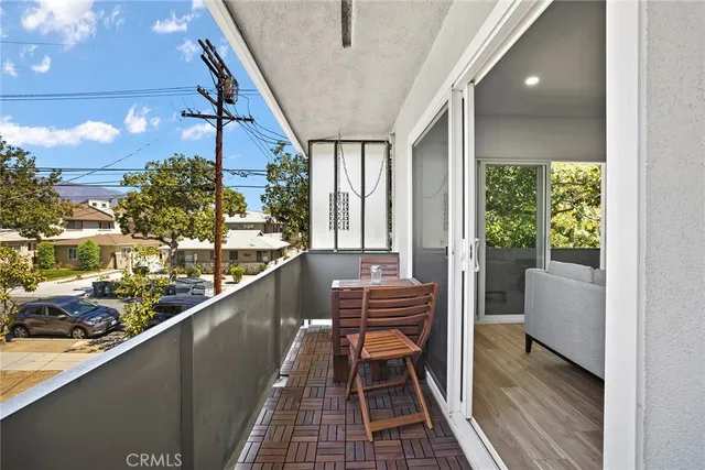 a view of balcony with furniture